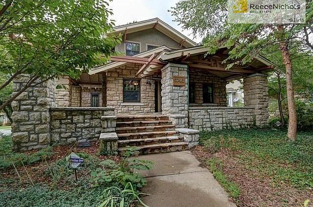 2277 square foot stone craftsman features two covered porches