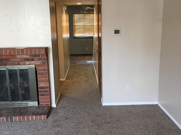 Hall to 1/2 bath and kitchen