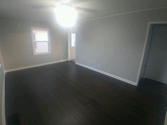 New living room, new paint, resurfaced hardwood floors 