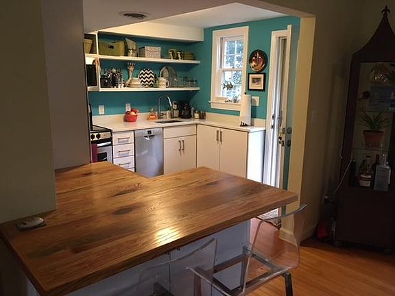 Open living, dining and kitchen - 2 acrylic bar chairs