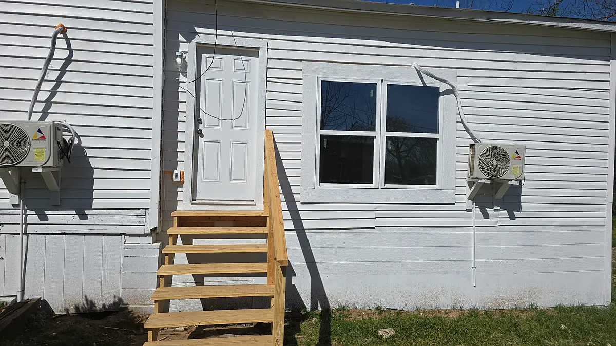 Right side of house/ master bedroom exit to yard - 1105 W Owings St
