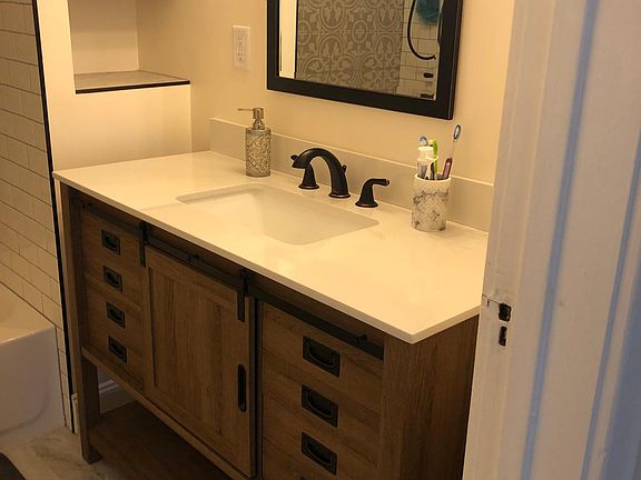 Bathroom vanity with storage shelves