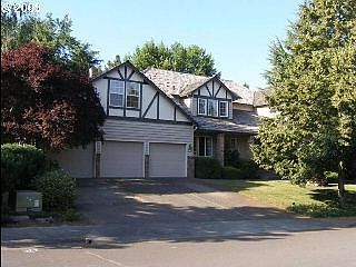 Front view with oversized 3 car garage