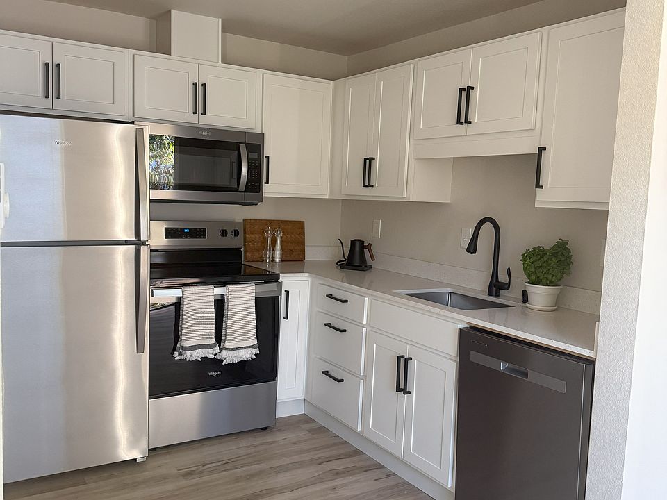 Kitchen with all new appliances, quartz countertops, shaker cabinets with easy-close drawers and doors