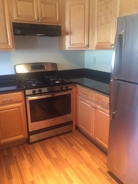 Stainless steel appliances (flooring varies)