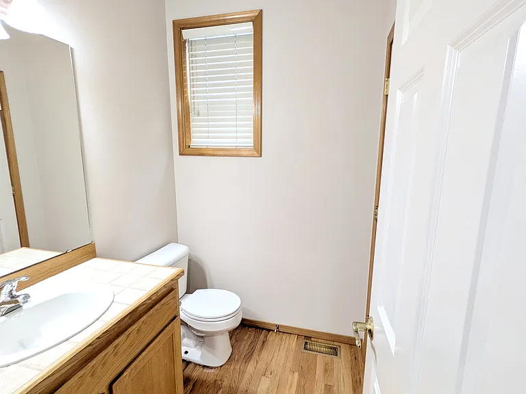 Downstairs Half Bath attached Closet under the stairs