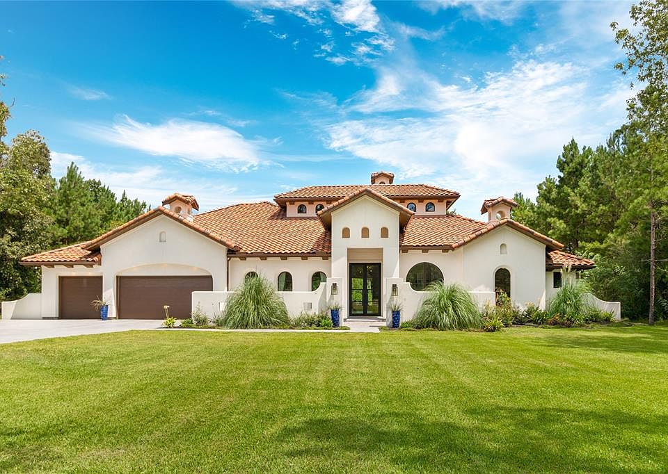 Custom Mediterranean in sought after Benders Landing Estates backing to private lake