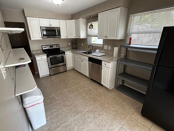 Kitchen w/ two fridges