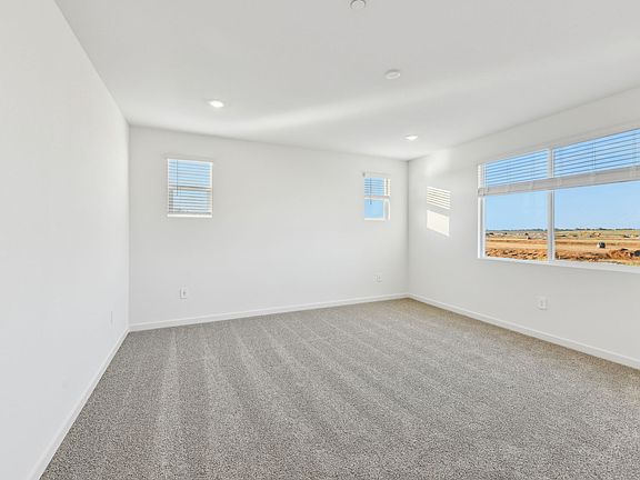 Residence 2 Primary Suite shown at a nearby Meritage Homes Community.