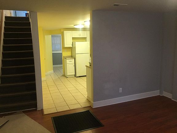 Living Rm 1st fl view from front door, kitchen beyond.