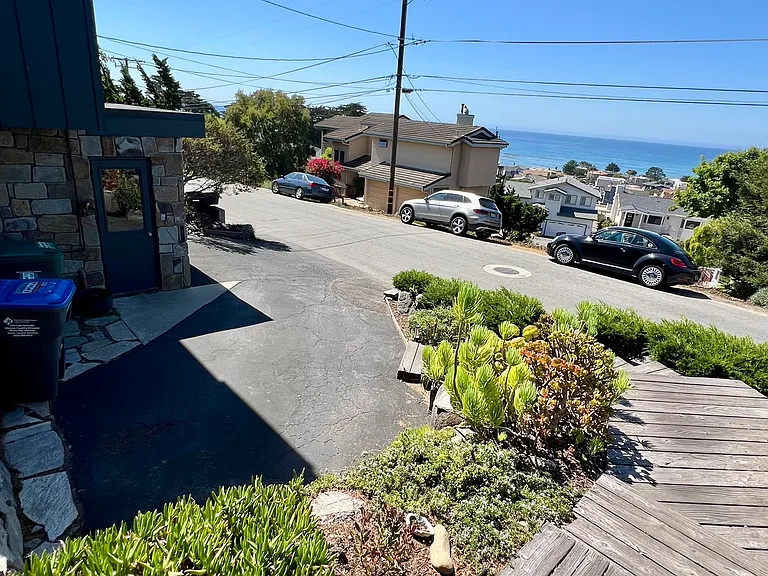 walking down street and garage on left