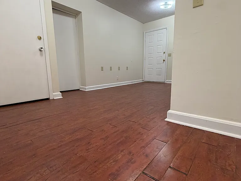 Cherry hardwood floors. Bedroom 1.