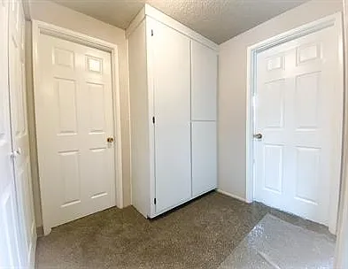 Hallway with storage & W/D Hookups