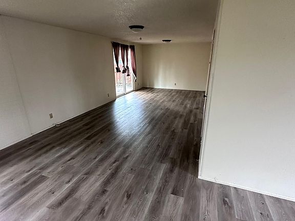 From the front living room, facing down the to the end of the family room