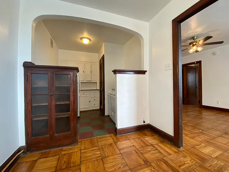 View from dining area into kitchen and main room.