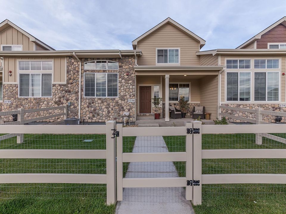 Small fenced yard with porch and great curb appeal