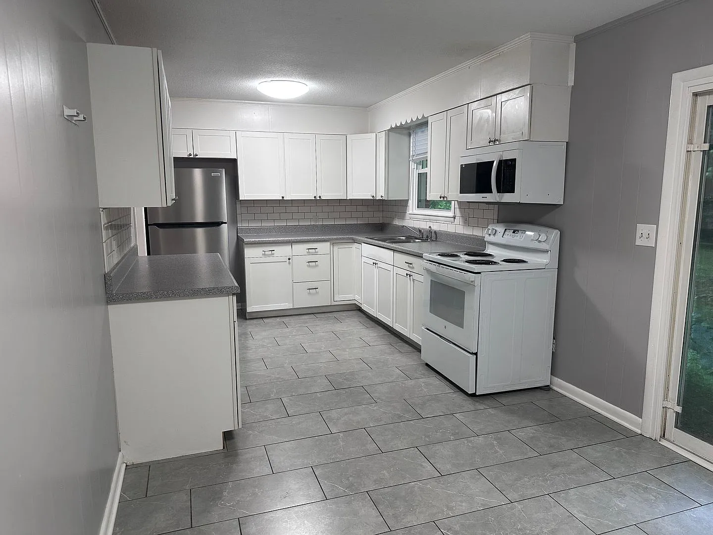 Freshly Updated Full-Brick Home with Garage — Photo 1