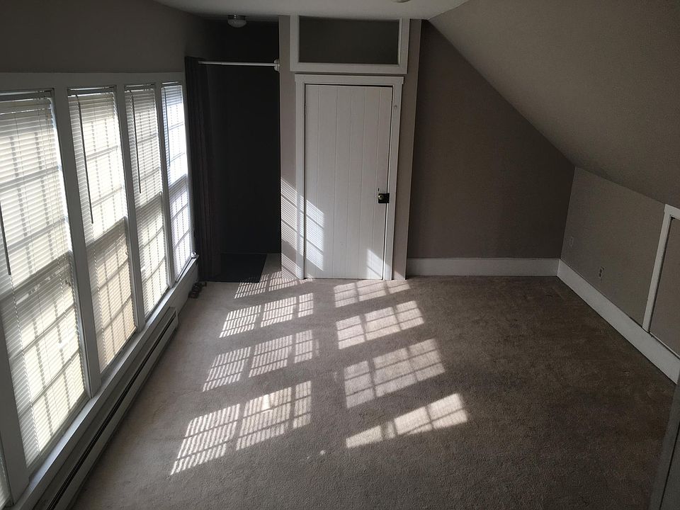 living rm with window wall and coat closet