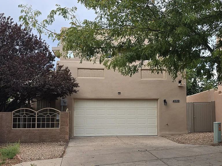Front of the house with 2 car garage and additional 2 car parking in front of garage.