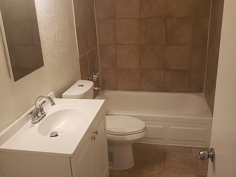 remodeled bathroom with surround tile
