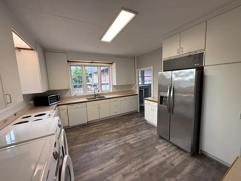 Kitchen with High Efficiency Washer/Dryer, Dishwasher, Microwave, Refrigerator, Stove/Oven, and Disposal!