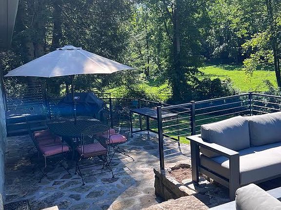 Enjoy a meal on the deck with a gas grill. The table seats 8.