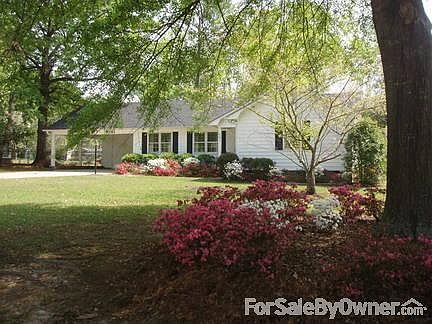 street side view of home
						:
						Springtime view of the front of the home with dogwoods and azaleas.