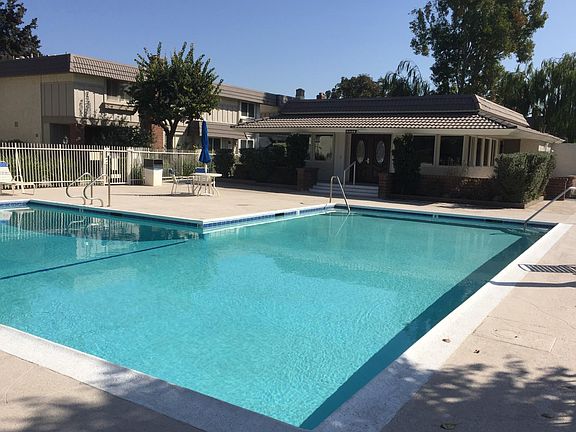 One of the Village's 4 pools is steps down the path from your front door...all the convenience without the noise. The major pool, jacuzzi, and spas are a five minute walk away.