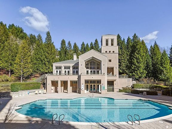 Pool and Hot Tub area with Fitness Center and Community Room in background.