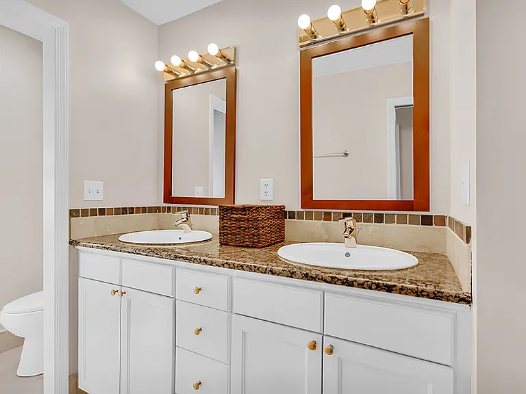 Double sinks in upstairs bath.