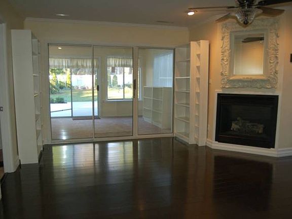 Beautiful new walnut wood floors in the family room that is adjacent to the sunroom where you can enjoy the oversized patio and the private back yard.
