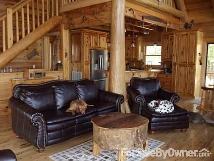 Living Room with cypress tree
						:
						Open floor plan makes this room great for entertaining and never missing a thing