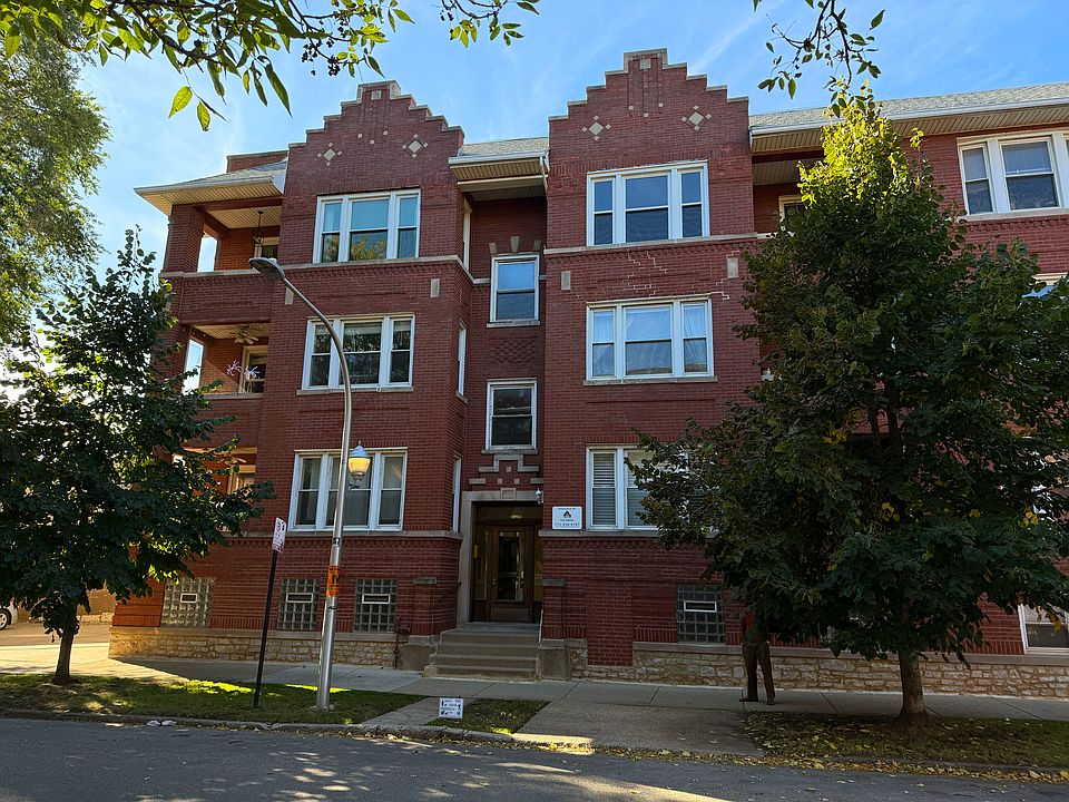 Facing the main building entrance on Lakewood. Unit is on the top floor in the right column.