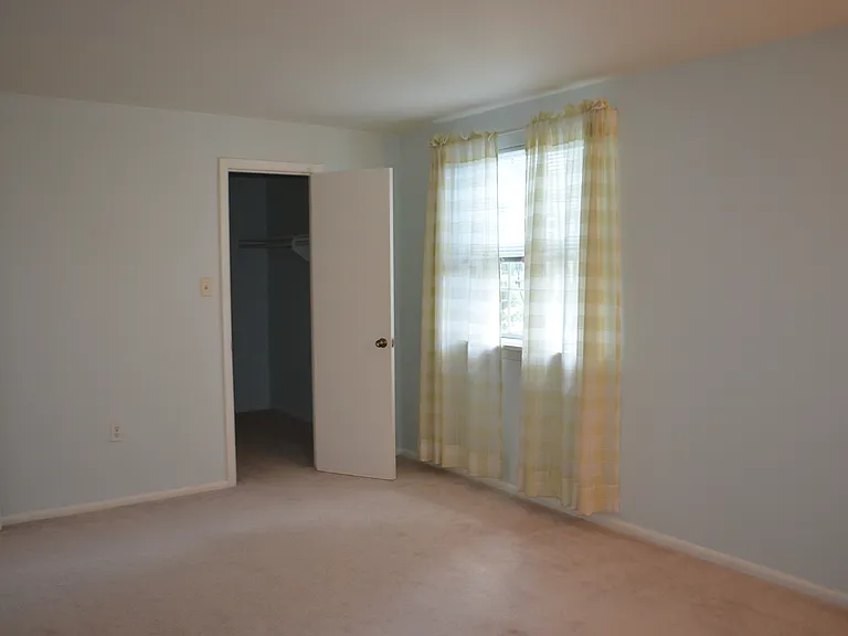 Bedroom and a view to the walking closet.
