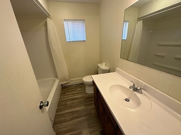Full bathroom with tub/shower combination.
