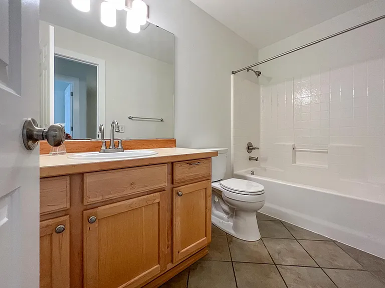Guest Bathroom with Tile flooring and recently upgraded fixtures
