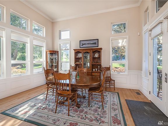 This bright room could be used as dining room or formal living room. French doors lead to back deck.