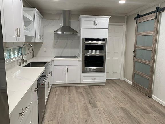 Barndoor with privacy glass; access to bathroom.