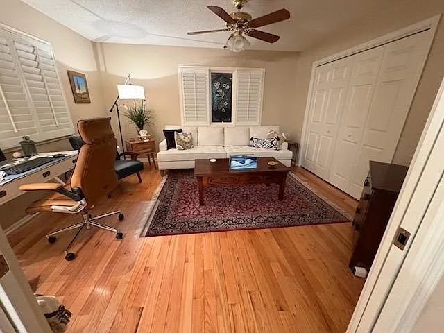 Third bedroom or den has plantation shutters and large closet.