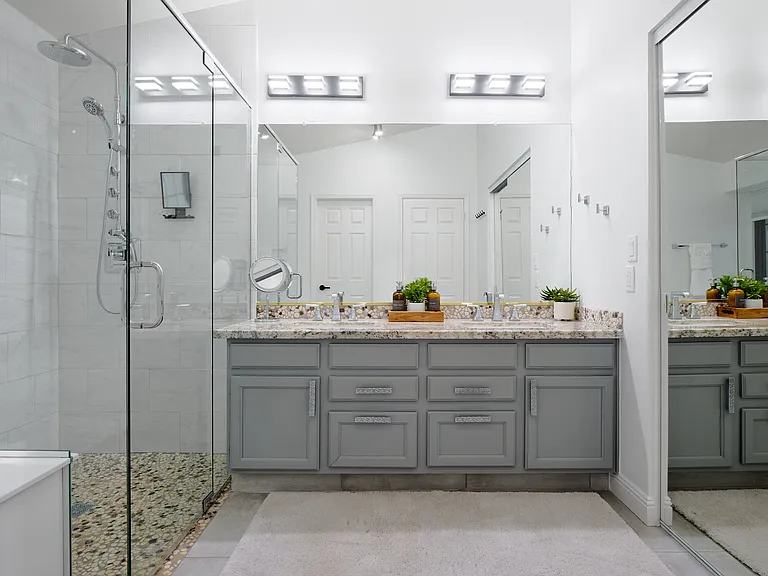 En-Suite Primary Bathroom: Roll in shower, 2 vanities