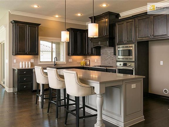 European soft close drawers, custom crafted alder cabinetry, generously sized work island and upgraded quartz countertops.