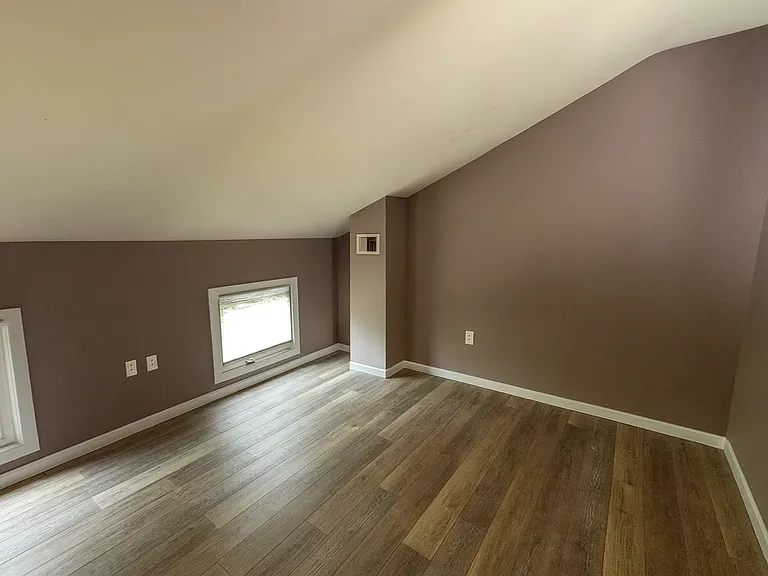 3rd Floor Front Bedroom. ** This photo was altered with similar flooring that is being installed