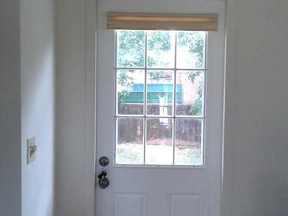 back door to large fenced yard