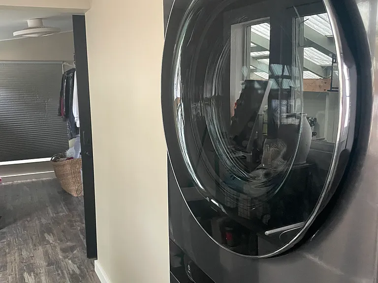 Washer and dryer with additional toilet.
Large closet room or small additional bedroom off laundry room.