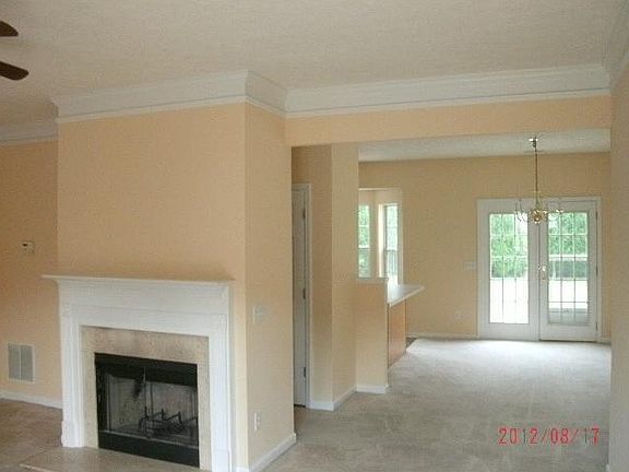 Living room looking into dining room.