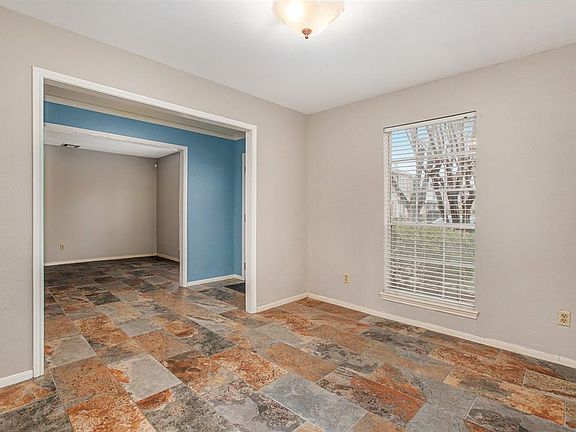 Formal Dining Room View to Front Entry and Formal Living Room