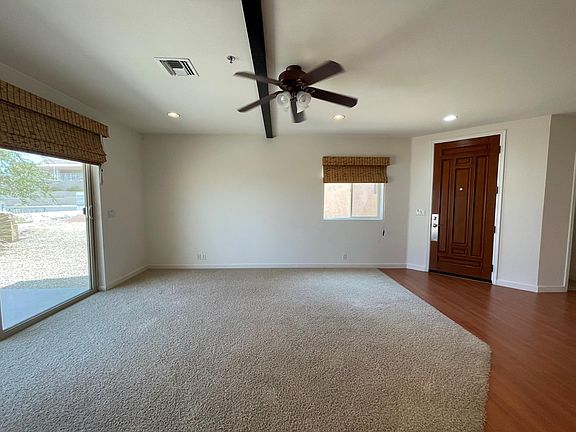 Living room with large sliding door to back yard.