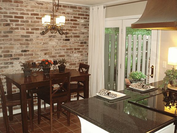 Dining area with exposed brick wall