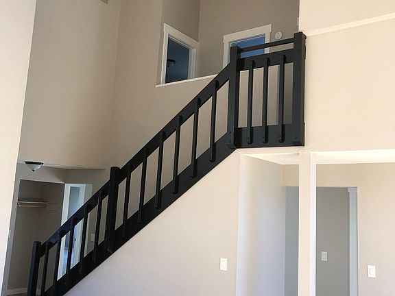Stairway to upstairs Primary bedroom, bathroom and 2nd bedroom.