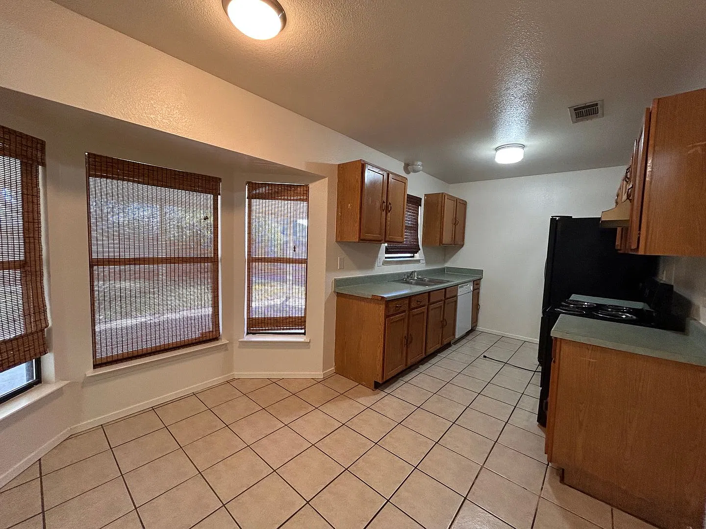 Available 11/12/26 Four bedroom on corner lot with St. Augustine grass and irrigation system! — Photo 2